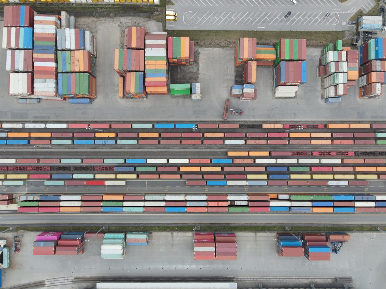 about-01 Aerial shot of stacked cargo containers at Regensburg port showcasing freight transport activity.